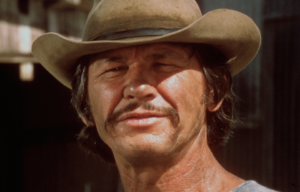 Headshot of Charles Bronson wearing a cowboy hat.