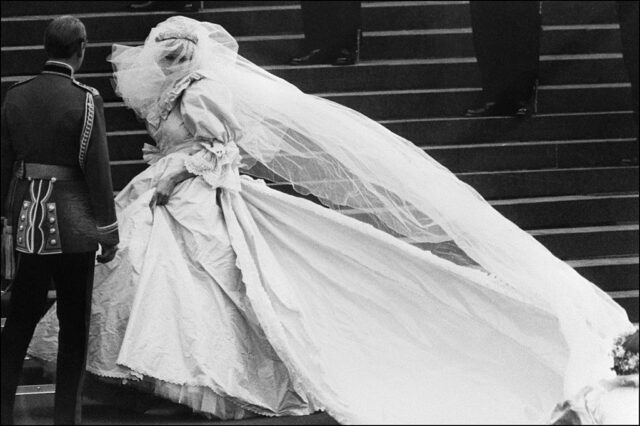 Lady Diana Spencer walking up stairs in her wedding dress