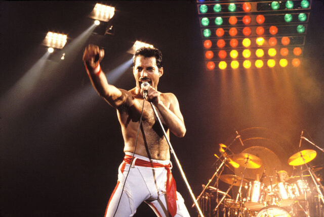 Freddie Mercury performing on stage