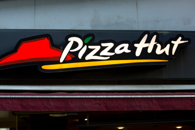 A Pizza Hut restaurant sign.