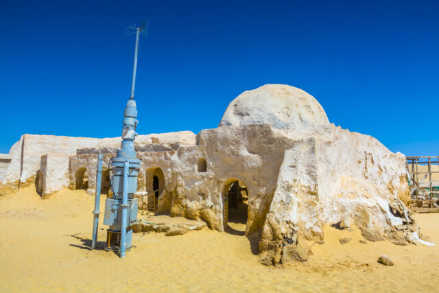 A 'Star Wars' prop outside of a desert hut.