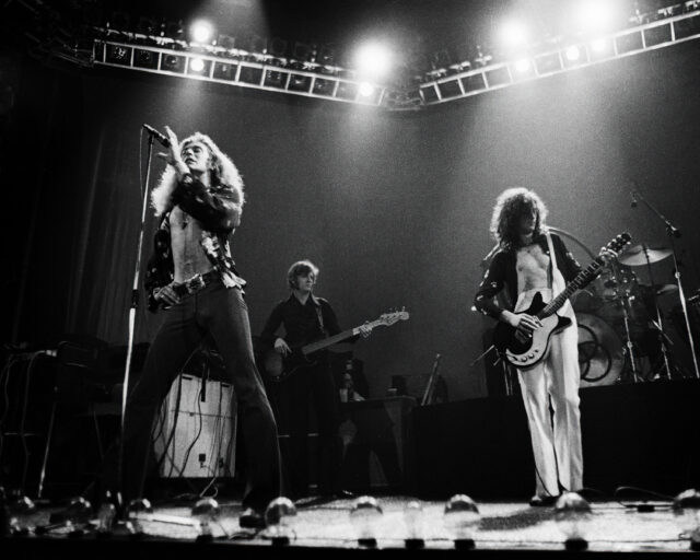 Led Zeppelin performing on stage.