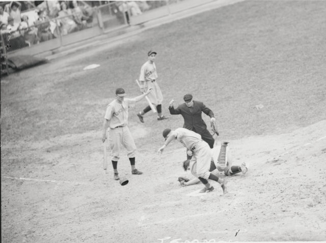 Four men playing baseball.