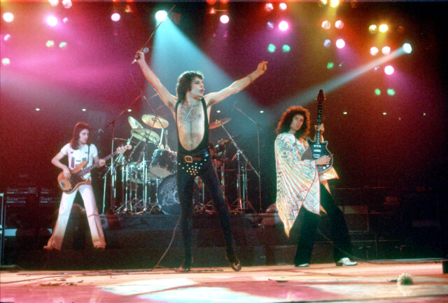 Queen performing on stage