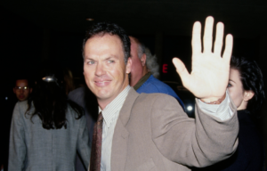 Michael Keaton looking back and waving.