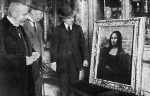 Three men stand by and look at the Mona Lisa.