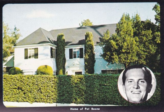 Postcard featuring a photograph of Pat Boone's mansion, with a portrait of him in the bottom right corner