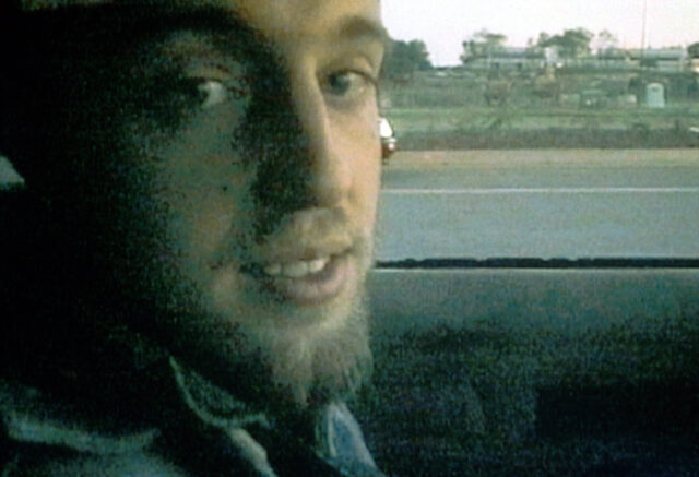 Joshua Leonard photographed in a car.