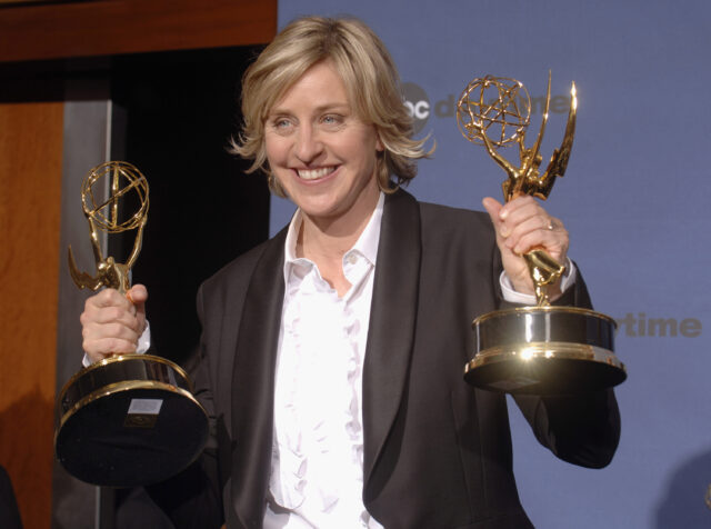 Ellen DeGeneres holding two Daytime Emmy Awards