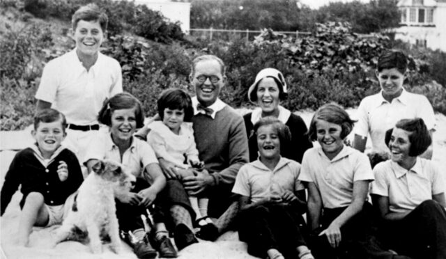 The Kennedy family sitting for a portait.