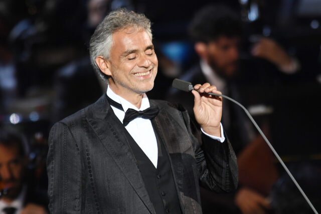 Andrea Bocelli singing into a microphone.