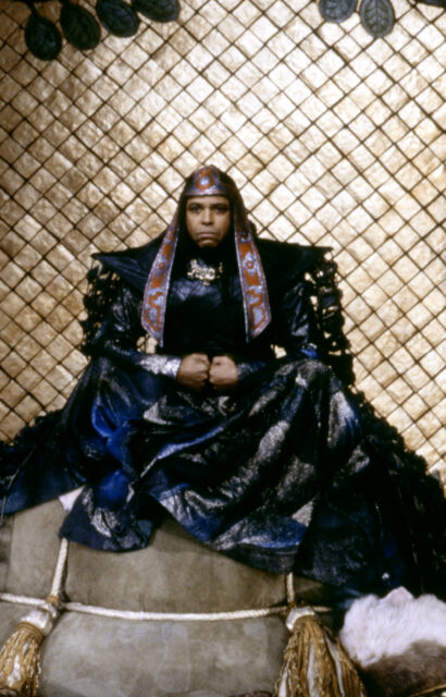 James Earl Jones sitting on a throne as Thulsa Doom.