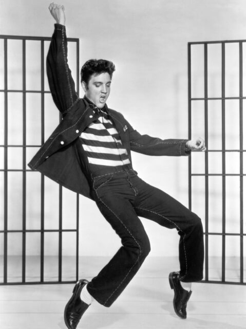 Elvis Presley dancing in jail clothes.