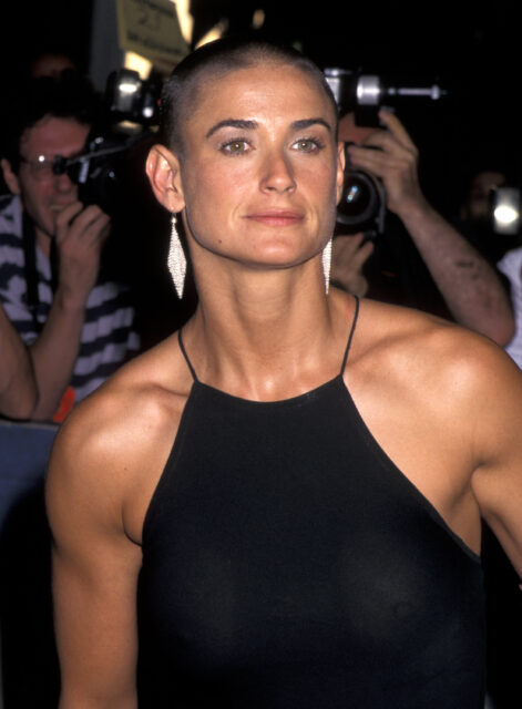 Headshot of Demi Moore with a shaved head.