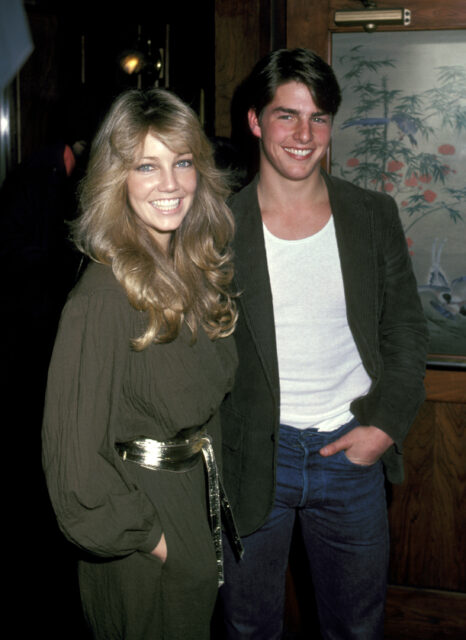 Heather Locklear and Tom Cruise standing together in a restaurant