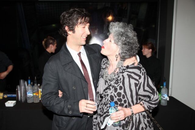 David Schwimmer and his mother smiling at one another.