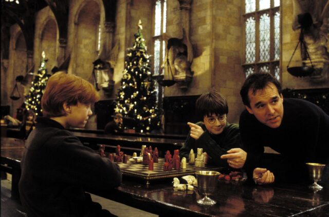 Daniel Radcliffe, Rupert Grint and Chris Columbus on the set of 'Harry Potter and the Sorcerer's Stone'