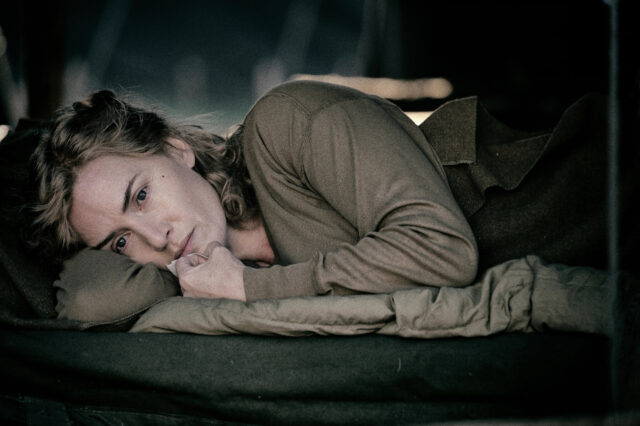 Kate Winslet laying on her side.