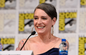 Paget Brewster sitting at a panel.