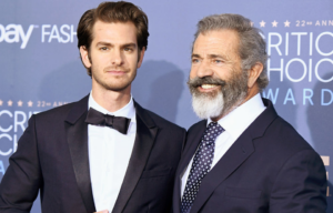 Andrew Garfield and Mel Gibson standing on a red carpet