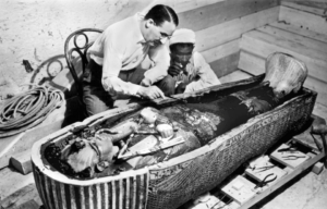 Howard Carter with an associate looking at the sarcophagus of King Tutankhamun