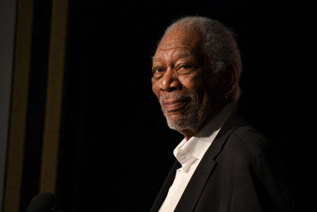 Morgan Freeman standing on a red carpet