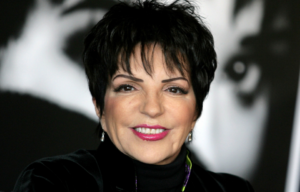 Liza Minnelli standing on a red carpet