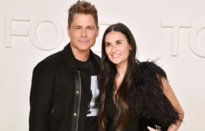 Rob Lowe and Demi Moore standing on a red carpet