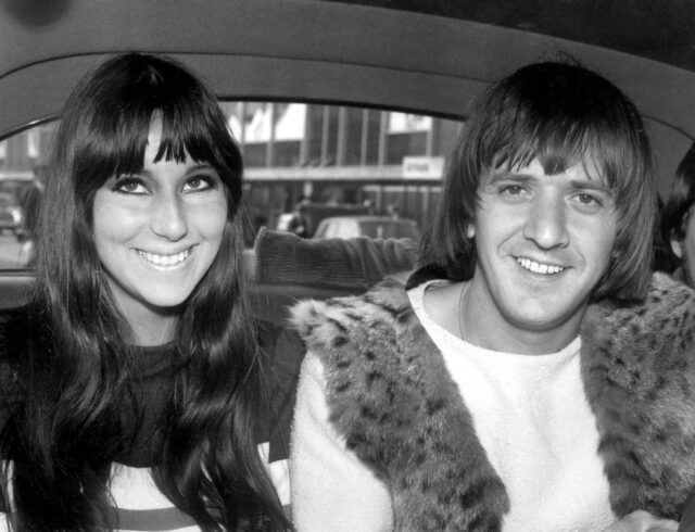 Cher and Sonny Bono sitting in the back of a car