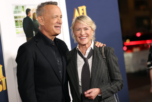 Tom Hanks and Robin Wright standing on a red carpet