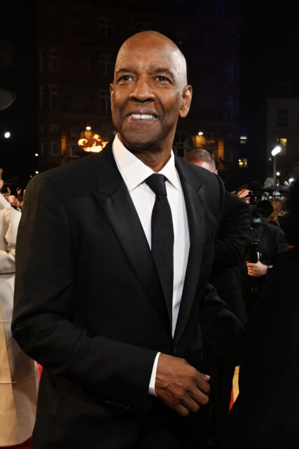 Denzel Washington standing in a suit