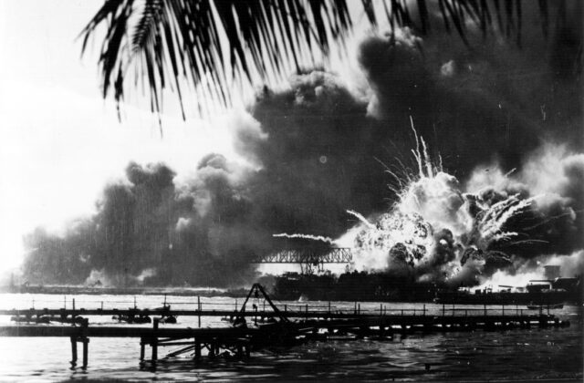 An explosion at pearl harbor seen from afar.