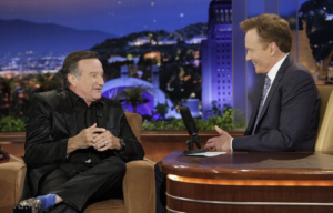 Robin Williams and Conan O'Brien sitting on the set of 'The Tonight Show with Conan O'Brien'