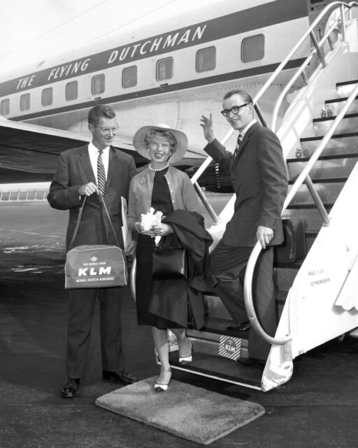 Michael Rockefeller, Rodman Rockefeller and Barbara Ann Olson standing next to an airplane