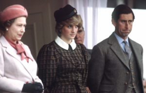 Queen Elizabeth II, Princess Diana, and Prince Charles all standing beside one another.