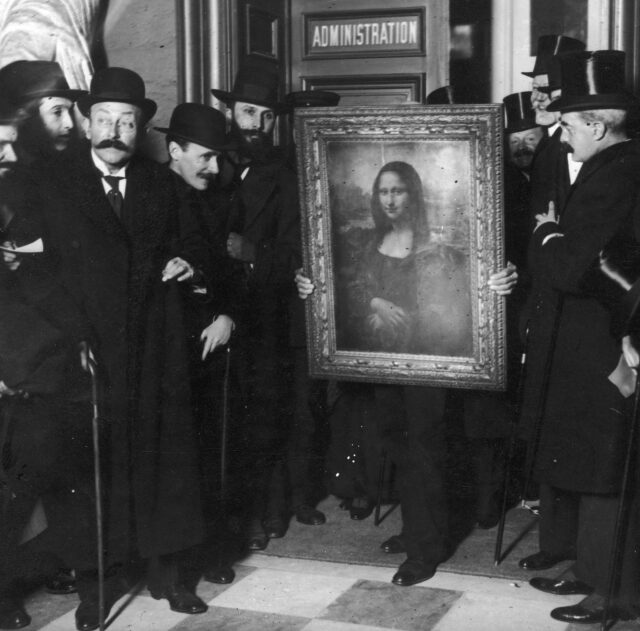 Several men standing around the Mona Lisa.