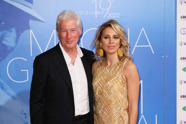 Richard Gere and Alejandra Silva standing on a red carpet