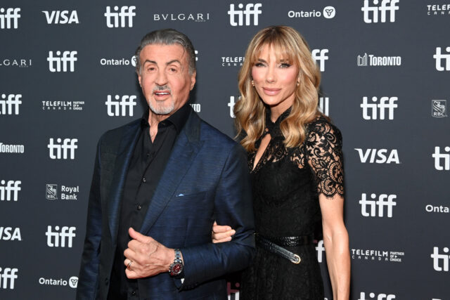 Sylvester Stallone and Jennifer Flavin standing together on a red carpet