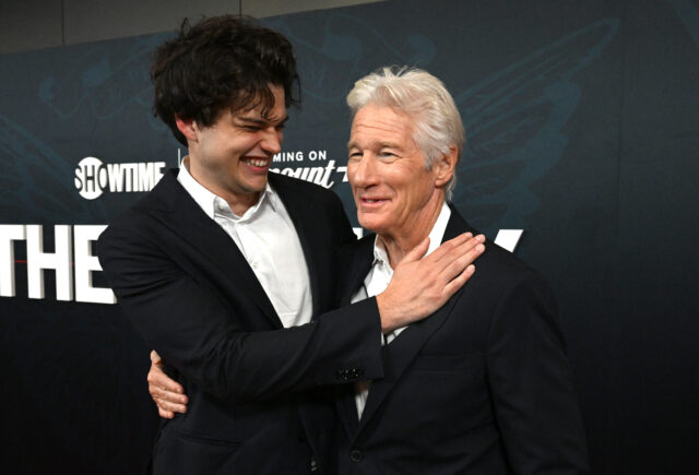 Homer and Richard Gere standing together on a red carpet