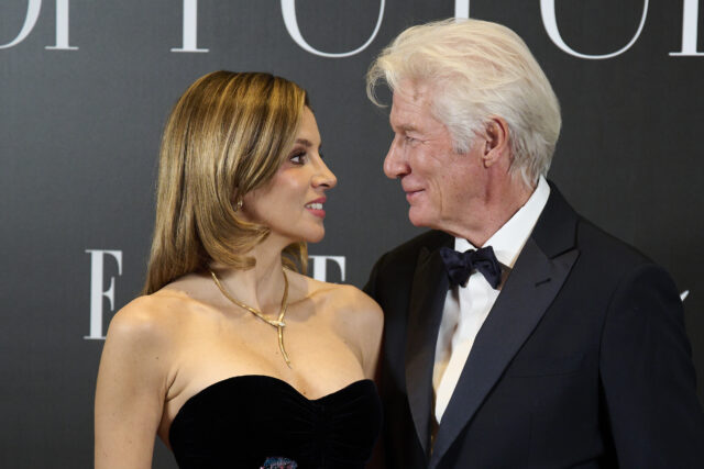 Alejandra Silva and Richard Gere standing together on a red carpet