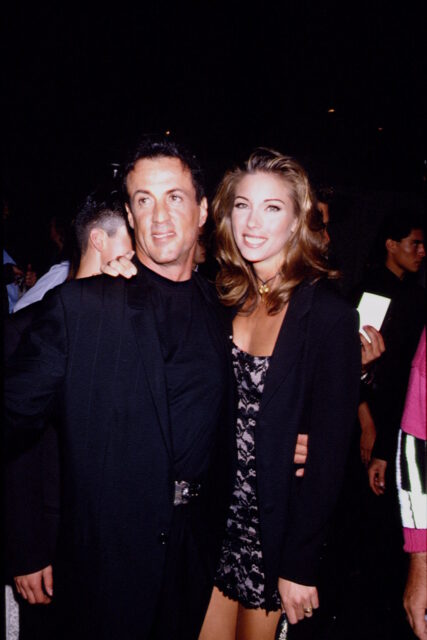 Sylvester Stallone and Jennifer Flavin standing together on a red carpet