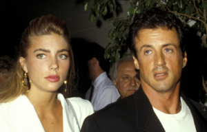 Jennifer Flavin and Sylvester Stallone standing together